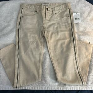 Brand new Free People khaki, low rise jeans. Zippers down each leg. Size 26.